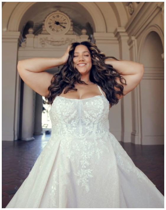 Photo of the smiling model wearing a bridal gown